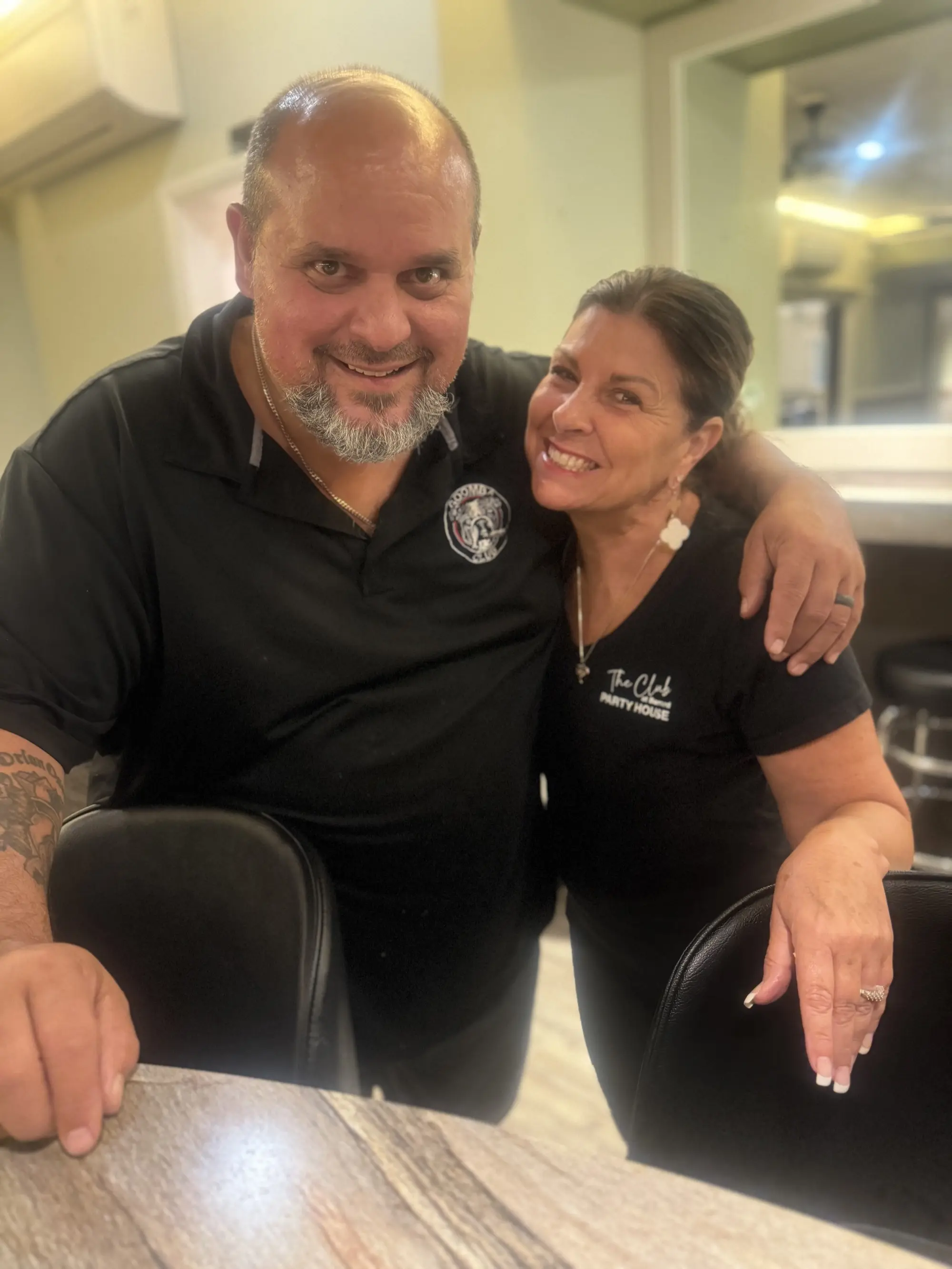 Owner Dave and staff member posing together at Barnard Hall event venue